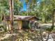 Charming home featuring a screened patio and lush landscaping at 1753 Ranchette Rd, Wesley Chapel, FL 33543