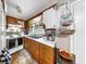 Compact kitchen featuring wood cabinets, and bright countertop at 1753 Ranchette Rd, Wesley Chapel, FL 33543