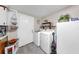 Convenient laundry room with washer, dryer, and utility sink at 1753 Ranchette Rd, Wesley Chapel, FL 33543