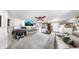 Bright living room featuring plush seating, ceiling fan, and mounted television at 1753 Ranchette Rd, Wesley Chapel, FL 33543