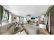 Cozy living room offering comfortable seating, natural light, and neutral decor at 1753 Ranchette Rd, Wesley Chapel, FL 33543