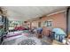 Spacious screened patio with outdoor furniture including seating and grill at 1753 Ranchette Rd, Wesley Chapel, FL 33543