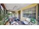 Covered front porch with shade, swing, and view of front door at 1753 Ranchette Rd, Wesley Chapel, FL 33543