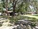 Expansive yard with mature trees offering plenty of shade and privacy at 1753 Ranchette Rd, Wesley Chapel, FL 33543