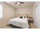 Cozy bedroom showcasing a comfortable bed, ceiling fan, and a neutral color palette at 19409 Wingrove Ln, Lutz, FL 33558