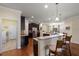 Well-appointed kitchen featuring dark cabinetry, granite countertops, and a breakfast bar at 19409 Wingrove Ln, Lutz, FL 33558