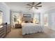 Serene main bedroom with soft lighting, neutral tones, and access to a private balcony at 19409 Wingrove Ln, Lutz, FL 33558