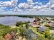 Beautiful aerial view of the property highlighting the serene lake and lush greenery at 22925 Collridge Dr, Land O Lakes, FL 34639
