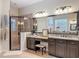 Bathroom featuring an elegant vanity area, a shower, and tasteful decor at 22925 Collridge Dr, Land O Lakes, FL 34639
