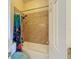 This bathroom has a shower-tub combination and tile at 22925 Collridge Dr, Land O Lakes, FL 34639