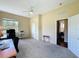 Spacious bedroom features neutral carpet, a ceiling fan, natural light, and ample closet space at 22925 Collridge Dr, Land O Lakes, FL 34639