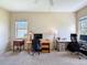 Sunlit bedroom with plush carpet and room for multiple desks provides a comfortable workspace at 22925 Collridge Dr, Land O Lakes, FL 34639