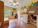 This themed bedroom features hardwood floors, a ceiling fan, and a fun wall mural at 22925 Collridge Dr, Land O Lakes, FL 34639