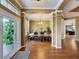 Spacious dining room with an open layout and beautiful hardwood flooring at 22925 Collridge Dr, Land O Lakes, FL 34639