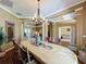 Formal dining room features an elegant chandelier and wainscoting details at 22925 Collridge Dr, Land O Lakes, FL 34639