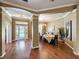Dining room with bright lighting, hardwood floors and seating for eight at 22925 Collridge Dr, Land O Lakes, FL 34639