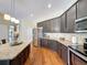 Well-equipped kitchen boasts granite countertops, stainless steel appliances, and dark wood cabinets at 22925 Collridge Dr, Land O Lakes, FL 34639