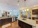 Open concept kitchen features granite countertops, stainless steel appliances, and a large island at 22925 Collridge Dr, Land O Lakes, FL 34639