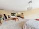 An expansive living room bathed in natural light featuring neutral decor and a seamless, flowing layout at 22925 Collridge Dr, Land O Lakes, FL 34639