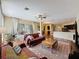 Living room features hardwood floors and an open concept that connects to the kitchen at 22925 Collridge Dr, Land O Lakes, FL 34639