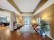 Cozy living room with hardwood floors, bright lighting, and access to kitchen at 22925 Collridge Dr, Land O Lakes, FL 34639