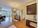 Living room with built-in bar area is adjacent to kitchen at 22925 Collridge Dr, Land O Lakes, FL 34639