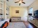 Bright office space featuring hardwood floors, a ceiling fan, and a large window at 22925 Collridge Dr, Land O Lakes, FL 34639