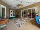 Inviting covered patio featuring stylish decor, a ceiling fan, and sliding glass doors for seamless indoor-outdoor living at 22925 Collridge Dr, Land O Lakes, FL 34639