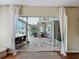 View from inside through sliding doors to a screened-in patio area at 22925 Collridge Dr, Land O Lakes, FL 34639