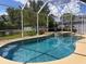 Inviting in-ground pool with a built-in spa and lush landscaping, perfect for outdoor enjoyment at 22925 Collridge Dr, Land O Lakes, FL 34639