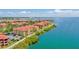 Waterfront condos feature Mediterranean architecture, red tile roofs, and stunning views of the bay and surrounding area at 2739 Via Capri # 1039, Clearwater, FL 33764