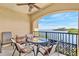 Relaxing outdoor balcony seating with serene water view, perfect for enjoying the views and weather at 2739 Via Capri # 1039, Clearwater, FL 33764