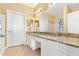 Bathroom features a dual sink vanity with granite countertops at 2739 Via Capri # 1039, Clearwater, FL 33764