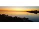 Gorgeous water view with a colorful sunset and a visible bridge at 2739 Via Capri # 1039, Clearwater, FL 33764