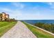 Paver path with a water view featuring blue sky and waterfront buildings at 2739 Via Capri # 1039, Clearwater, FL 33764