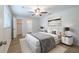 This bedroom offers a ceiling fan, a walk-in closet, and a modern, minimalist design aesthetic at 314 Circle Dr, Palm Harbor, FL 34683
