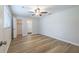A bright bedroom is complemented by wood-look floors, and access to a walk-in closet and en suite bathroom at 314 Circle Dr, Palm Harbor, FL 34683