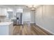 Bright kitchen features stainless steel appliances, quartz countertops, hardwood floors, and ample sunlight at 314 Circle Dr, Palm Harbor, FL 34683