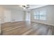 Bright living room featuring beautiful hardwood flooring and a large window for plenty of natural light at 314 Circle Dr, Palm Harbor, FL 34683