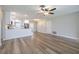 Open-concept living room featuring hard surface floors, plenty of natural light, and modern stainless steel appliances at 314 Circle Dr, Palm Harbor, FL 34683