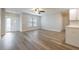 Bright living room featuring beautiful hardwood flooring and a large window for plenty of natural light at 314 Circle Dr, Palm Harbor, FL 34683