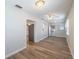 Bright living room with neutral decor, bright windows, ceiling fan, and hardwood floors at 314 Circle Dr, Palm Harbor, FL 34683