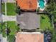 Birds eye view of the home shows the roof, driveway, and mature landscaping at 3304 W Harbor View Ave, Tampa, FL 33611