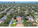 The aerial view highlights the home's proximity to the bay, pool and surrounding neighborhood at 3304 W Harbor View Ave, Tampa, FL 33611