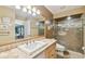 Updated bathroom featuring a tiled shower, large mirror, and modern fixtures at 3304 W Harbor View Ave, Tampa, FL 33611