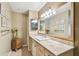 Well-lit bathroom featuring a wide vanity with decorative tiles and a large mirror at 3304 W Harbor View Ave, Tampa, FL 33611