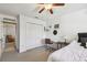 Bright bedroom features a ceiling fan, closet and desk workspace at 3304 W Harbor View Ave, Tampa, FL 33611