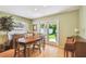 Inviting dining room with hardwood floors and French doors leading to the backyard at 3304 W Harbor View Ave, Tampa, FL 33611