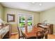 Elegant dining room boasting hardwood floors and access to a serene backyard through glass doors at 3304 W Harbor View Ave, Tampa, FL 33611