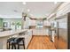 Bright kitchen with modern appliances, white cabinets, and a breakfast bar at 3304 W Harbor View Ave, Tampa, FL 33611